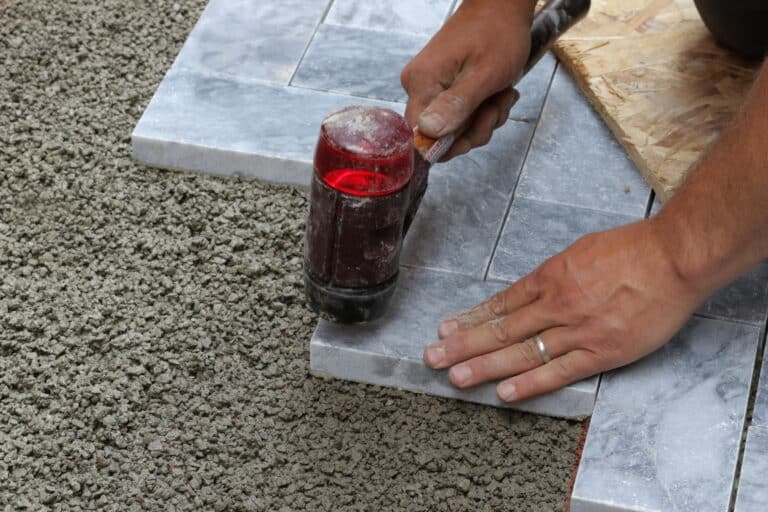 Pounding Stones On Bedding Mortar